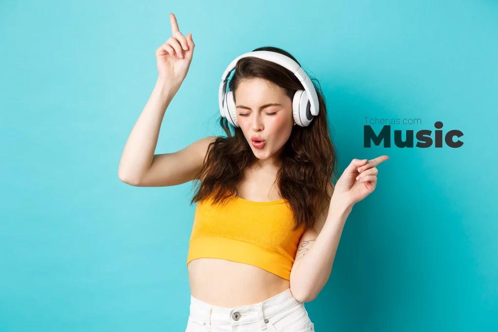 stylish modern woman headphones listening music dancing enjoying favorite songs earphones standing against blue background copy